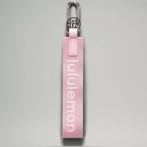 Lululemon pink peony never lost keychain